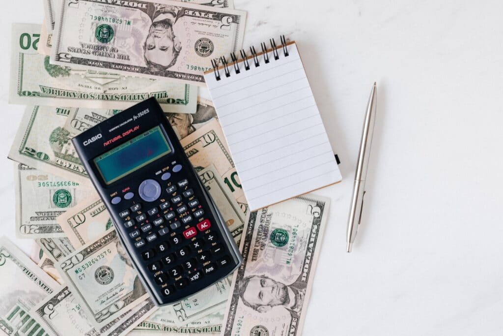 Calculator and money with a notepad